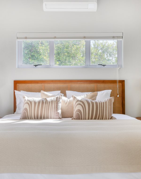 A bedroom with garden views